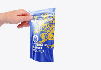 Glossy Stand-up Pouch with Hand Mockup - obrazy, fototapety, plakaty