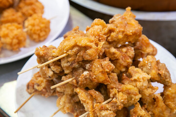 Chinese fried chicken balls in a street food stand in Kobe, Japan.