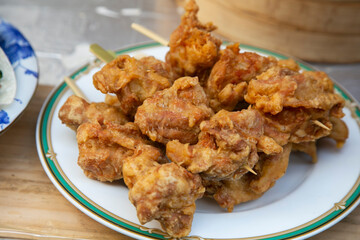 Chinese fried chicken balls in a street food stand in Kobe, Japan.