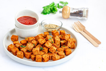 Crispy Baked Tofu with Tomato Ketchup Low Angle Close Up Photo