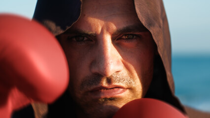 Ipnotic Gaze Of An Hooded Monk Ready To Fight 