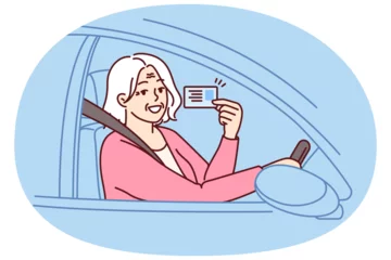 Selbstklebende Fototapeten Happy elderly woman demonstrates driver license sitting behind wheel of car and rejoices at opportunity to go on road trip. Positive grey-haired old lady got driver ID after retirement © drawlab19