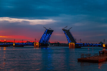 Open Palace Bridge in St. Petersburg on a white night. - 779664531