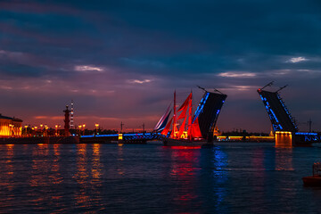 Fototapeta na wymiar Brig with scarlet sails near the open Palace Bridge. White Night.