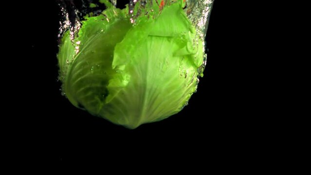 Super slow motion cabbage in water with air bubbles. Filmed on a high-speed camera at 1000 fps. High quality FullHD footage