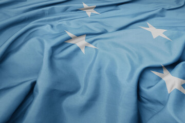 waving colorful national flag of Federated States of Micronesia . - obrazy, fototapety, plakaty