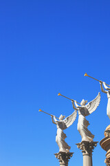 The statues of winged troubadours - obrazy, fototapety, plakaty