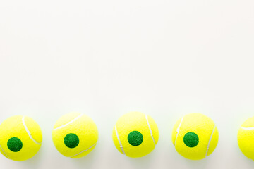 Set of green tennis balls, top view. Sport games background - 779667165