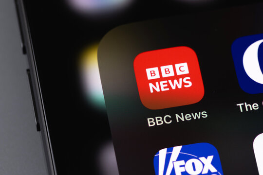 BBC News logo website on a screen smartphone, iPhone closeup. BBC News is an operational business division of the British Broadcasting Corporation. Batumi, Georgia - December 22, 2023