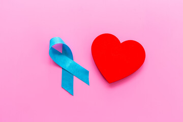 Blue ribbon with heart for world colon cancer day - 779676185