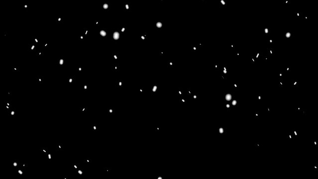 Snow falls in winter outside, at night. Big snowball falling on screen.