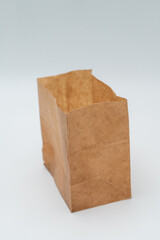 Brown paper bag on white background - 779697546
