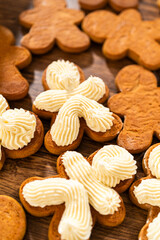 Making Festive Gingerbread Sandwiches on Rustic Wooden Table