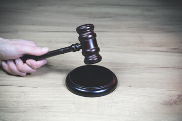 Judge Hammer for adjudication..Adjudgement Gavel with wooden stand. Auction or Lawyer decision. Law and justice concept. Court of law..Pronouncing sentence, striking Gavel.