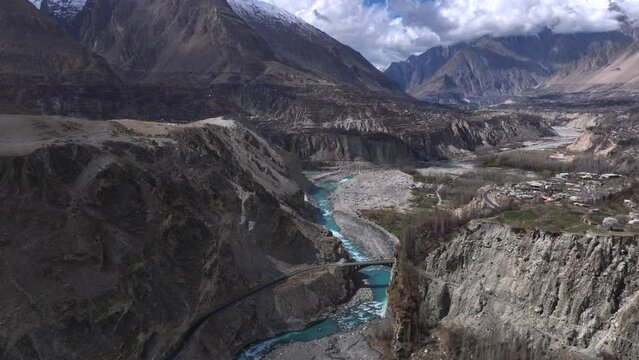 Karakoram Highway along Indus River in Hunza Valley, Pakistan. Gilgit-Baltistan, Himalayas Mountains, Aerial Drone Shot