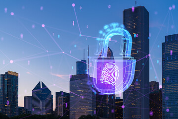 A hologram of a lock and fingerprint over a city skyline at dusk. Digital concept of security and...