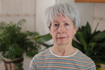 Senior woman feeling  preoccupied at home