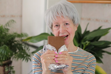 Senior woman enjoying some chocolate 