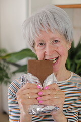 Senior woman enjoying some chocolate