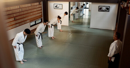 Japanese people, bow and learning aikido in dojo place in training and modern martial arts class of...