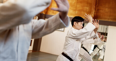 Aikido class, group and people for martial arts, strike or together for combat at training, gym or...