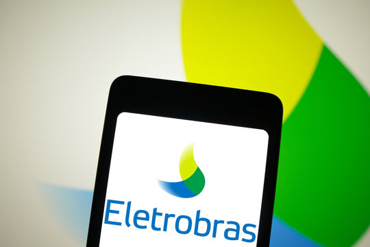 April 8, 2024, Brazil. In this photo illustration, the Eletrobras logo is displayed on a smartphone screen and in the background.