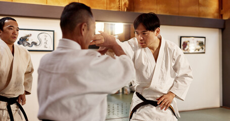 Japanese master, student or fighting in martial arts in dojo place, block or training in aikido...