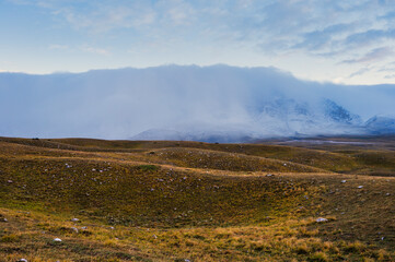 mountain landscape inside the National Park of Gran Sasso and Monti della Laga during an autumnal and cloudy morning, L'Aquila, Italy     
