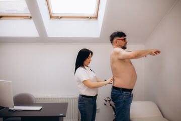 Man having chiropractic back adjustment. Physioterapy, osteopathy, alternative medicine pain relief...