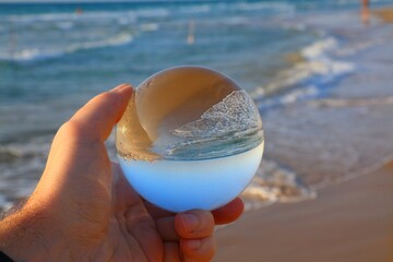 Fototapeta na wymiar Haifa beach Israel in magic glass ball
