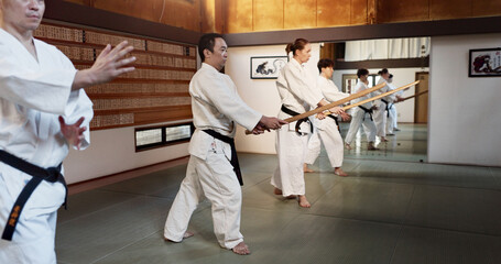 Aikido, stick and fight class with weapon training and wooden sword for self defence exercise....