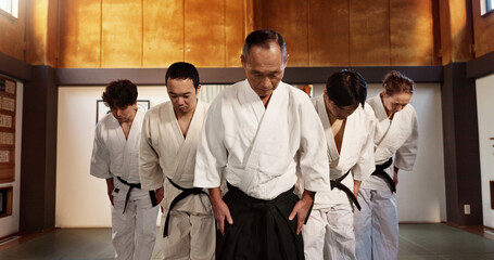 Japanese people, bow and respect in aikido in dojo place, training and modern martial arts class of...
