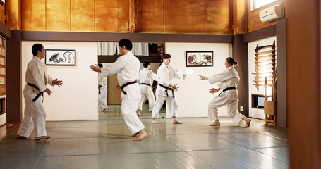 Japanese people, training and learning martial arts in dojo place in fight and aikido class of self...