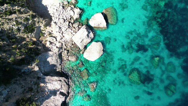 A drone view of Cala Goloritzé, an azure beach located in the town of Baunei, in the southern part of the Gulf of Orosei, in the Ogliastra region of Sardinia.