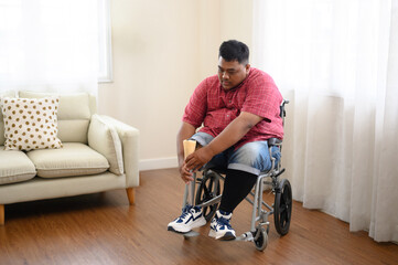 A big fat man was wearing his prosthetic leg in the living room.