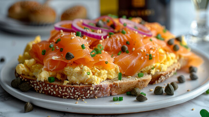 Smoked salmon and scrambled eggs on a bagel - obrazy, fototapety, plakaty