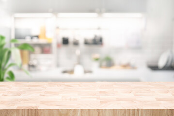 Selective focus.End grain wood counter,table top on blur kitchen counter in morning background.