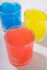 Colorful slushie drink, multicolored frozen juice cocktail