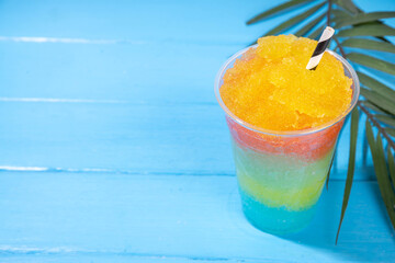 Colorful slushie drink, multicolored frozen juice cocktail
