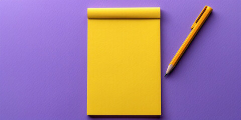 Professional yellow notepad with pen on vibrant purple background, flat lay design with copy space, top view perspective