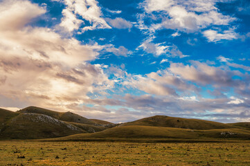 mountain landscape inside the National Park of Gran Sasso and Monti della Laga during an autumnal and cloudy morning, L'Aquila, Italy     