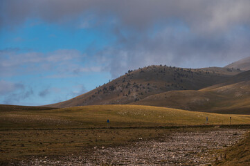 mountain landscape inside the National Parl of Gran Sasso and Monti della Laga during an autumnal and cloudy morning, L'Aquila, Italy     