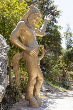 Neo Chorio, Cyprus. 01 April 2024: Golden statue of Priapus. Adonis Baths, famous landmark near Paphos, Cyprus