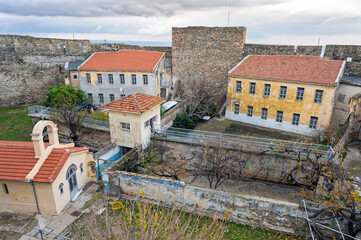 The Heptapyrgion or Yedikule (Seven Towers), a former fortress, later a prison and now a museum in Thessaloniki, Greece. Panoramic view of the buildings of the prison and part of the walls. - 779764500