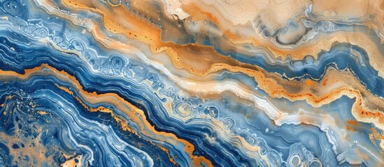 A detailed view of a blue and orange marble texture resembling a fluid landscape created by geological phenomena. The pattern mimics wind waves in shades of electric blue and rock