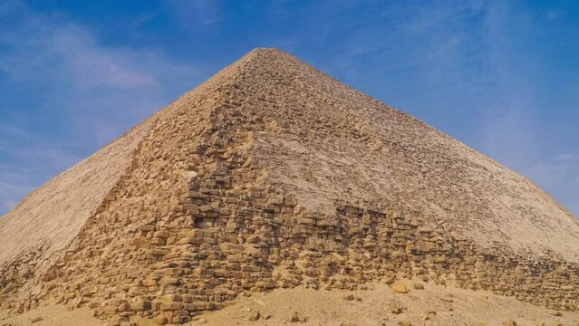 The Bent Pyramid is an ancient Egyptian pyramid located at the royal necropolis of Dahshur, approximately 40 kilometres south of Cairo, built under the Old Kingdom Pharaoh Sneferu. Egypt
