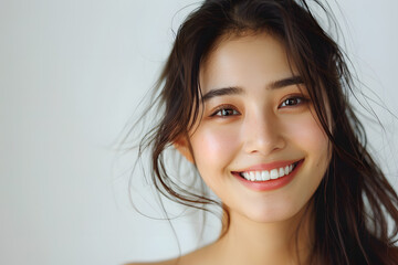 Close up photo portrait of smiling beautiful Japanese woman with long dark hair  isolated on white background