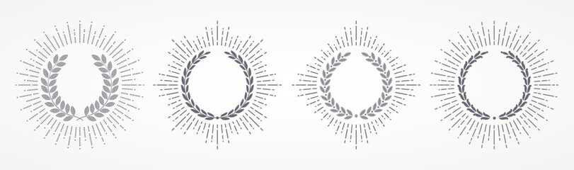 Set of laurel wreath with sunburst rays. Winner award and achievement heraldry symbol. Vector illustration.