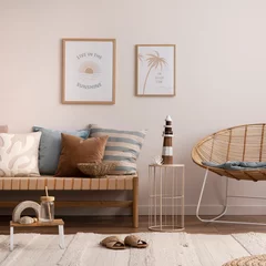  Interior design of cozy and summer living room with rattan armchair, couch, pillows, mock u poster frame, side table, bamboo ladder, decoration, carpet and personal accessories. Stylish home decor. © FollowTheFlow