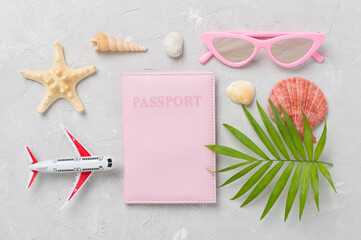 Bright flat lay with travel accessories on concrete background, top view